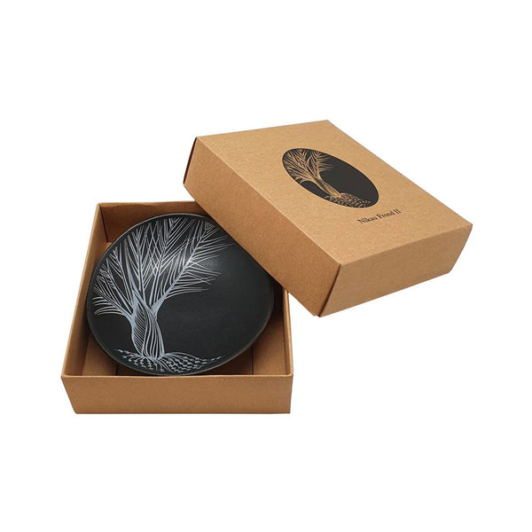 Image of black Jo Luping Nikau Frond 10cm Bowl in kraft cardboard gift box that it comes in.