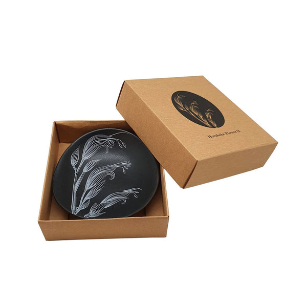 Image of black Harakeke Flower 10cm Bowl in the kraft cardboard gift box that it comes in.