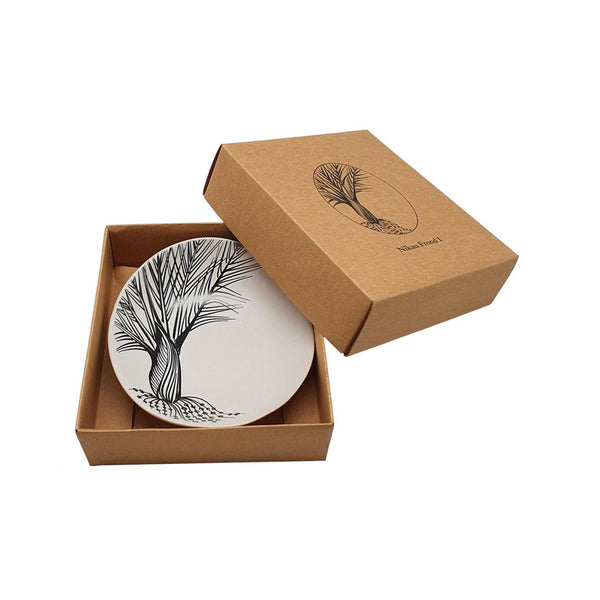 Image of white Jo Luping Nikau Frond 10cm Bowl in kraft cardboard gift box that it comes in.