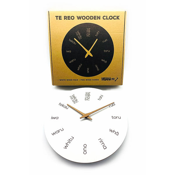 Clearcut image of Moana Road Te Reo Māori Wooden Clock and kraft cardboard box in which it comes packaged.